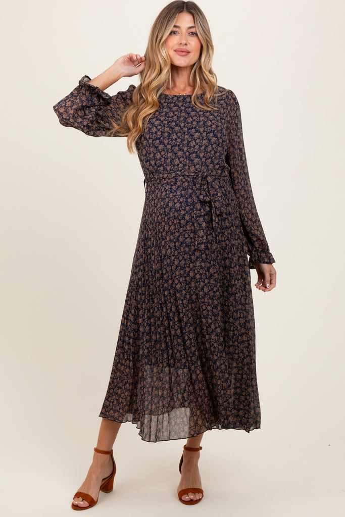 Woman wearing a dark floral dress on a white background