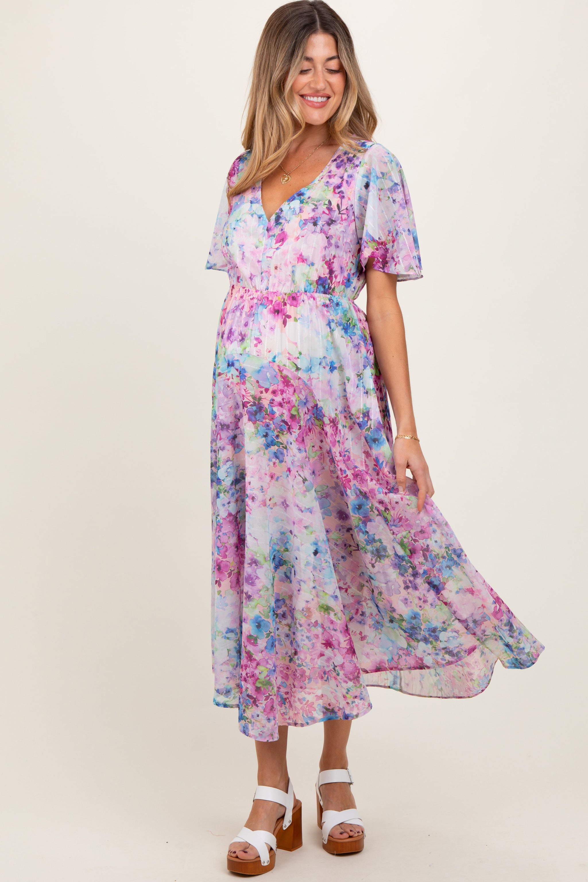 Woman wearing a floral dress on a white background