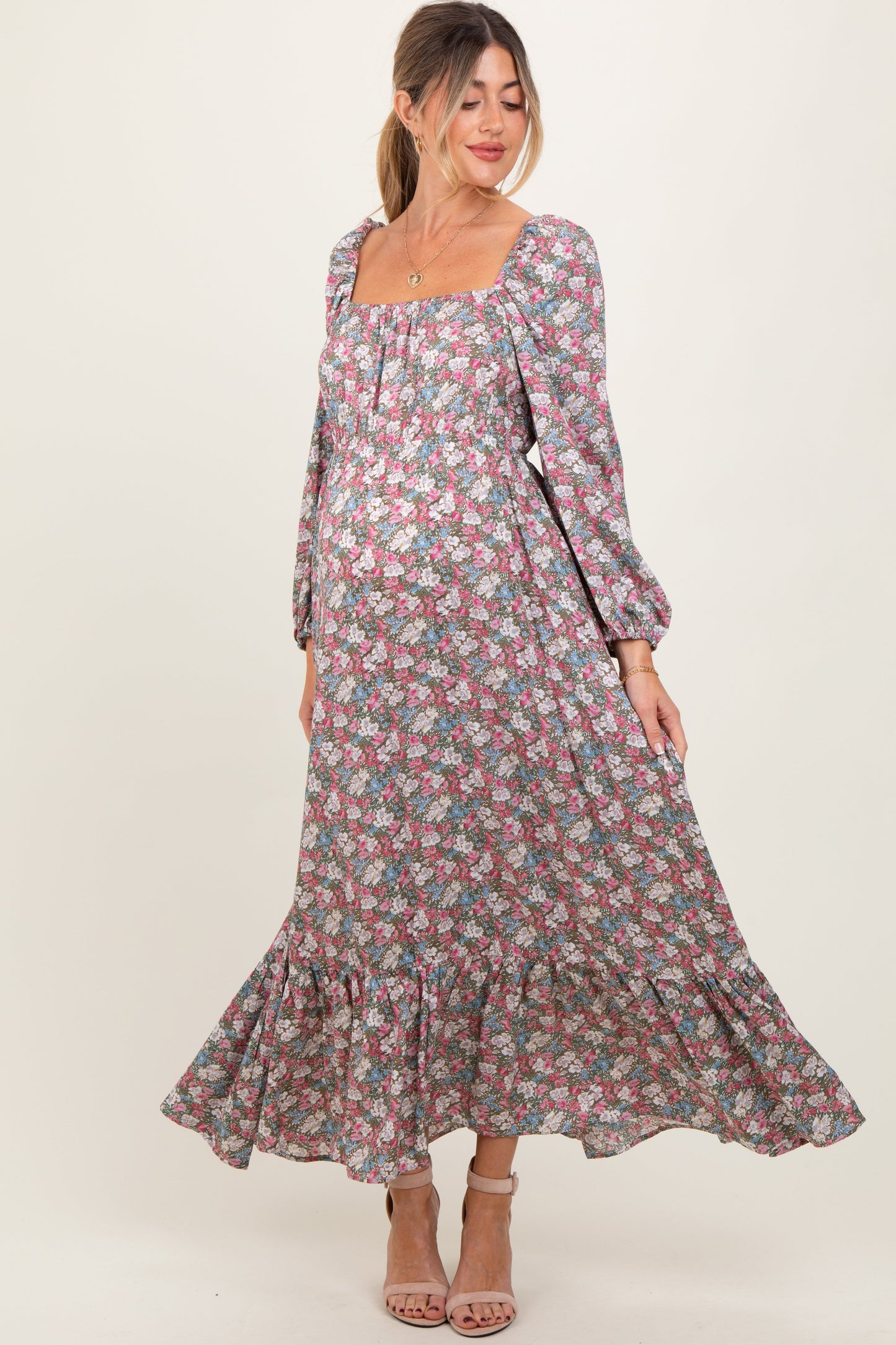 Woman wearing a floral dress on a white background