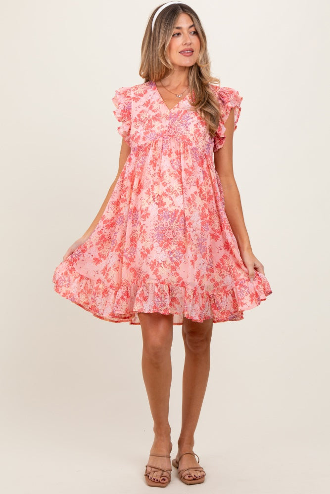 Woman wearing a pink floral dress on a white background