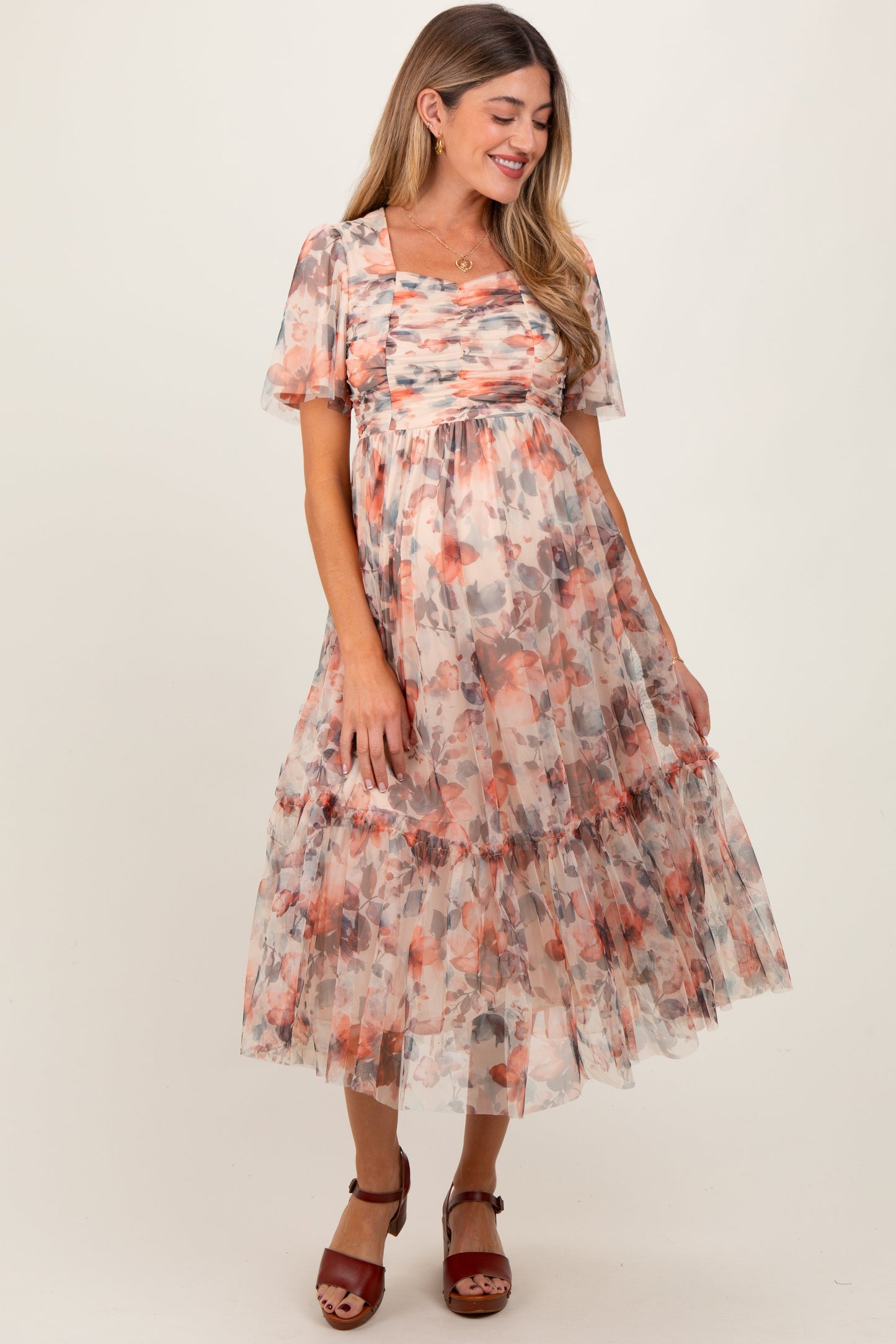 Woman wearing a floral dress on a white background