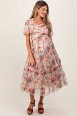Woman wearing a floral dress on a white background