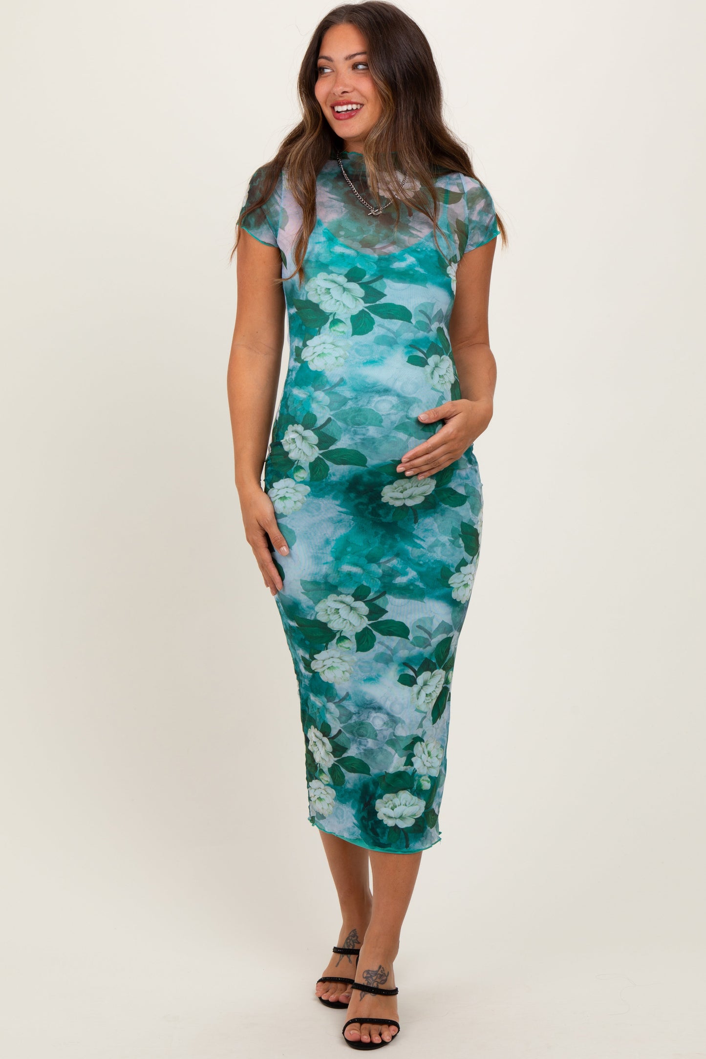 Woman wearing a floral dress on a white background