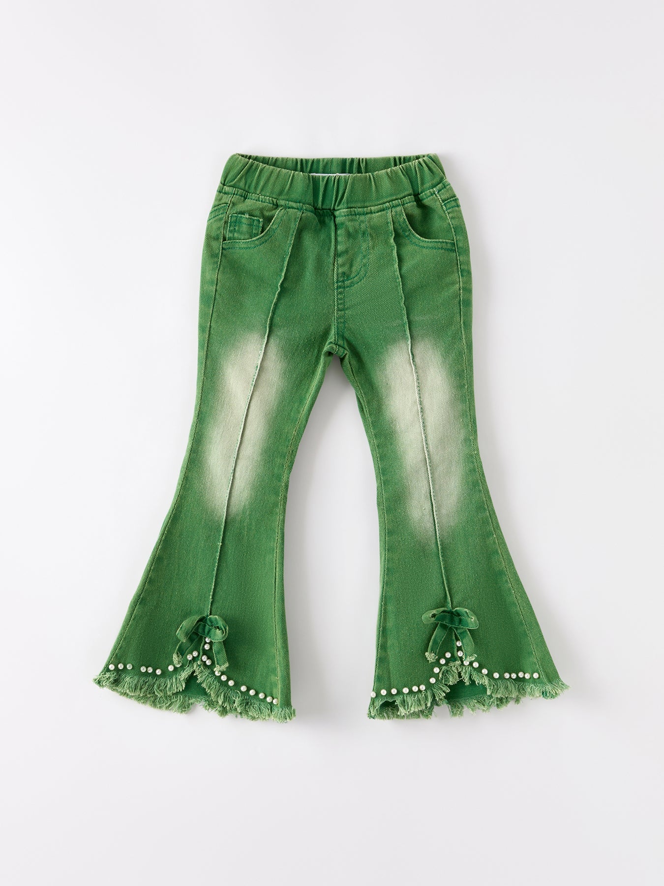 Green flared jeans with ruffled hem on a white background