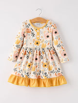 Floral-patterned dress with yellow accents on a white background