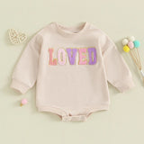 Baby romper with 'LOVED' text on a light green background