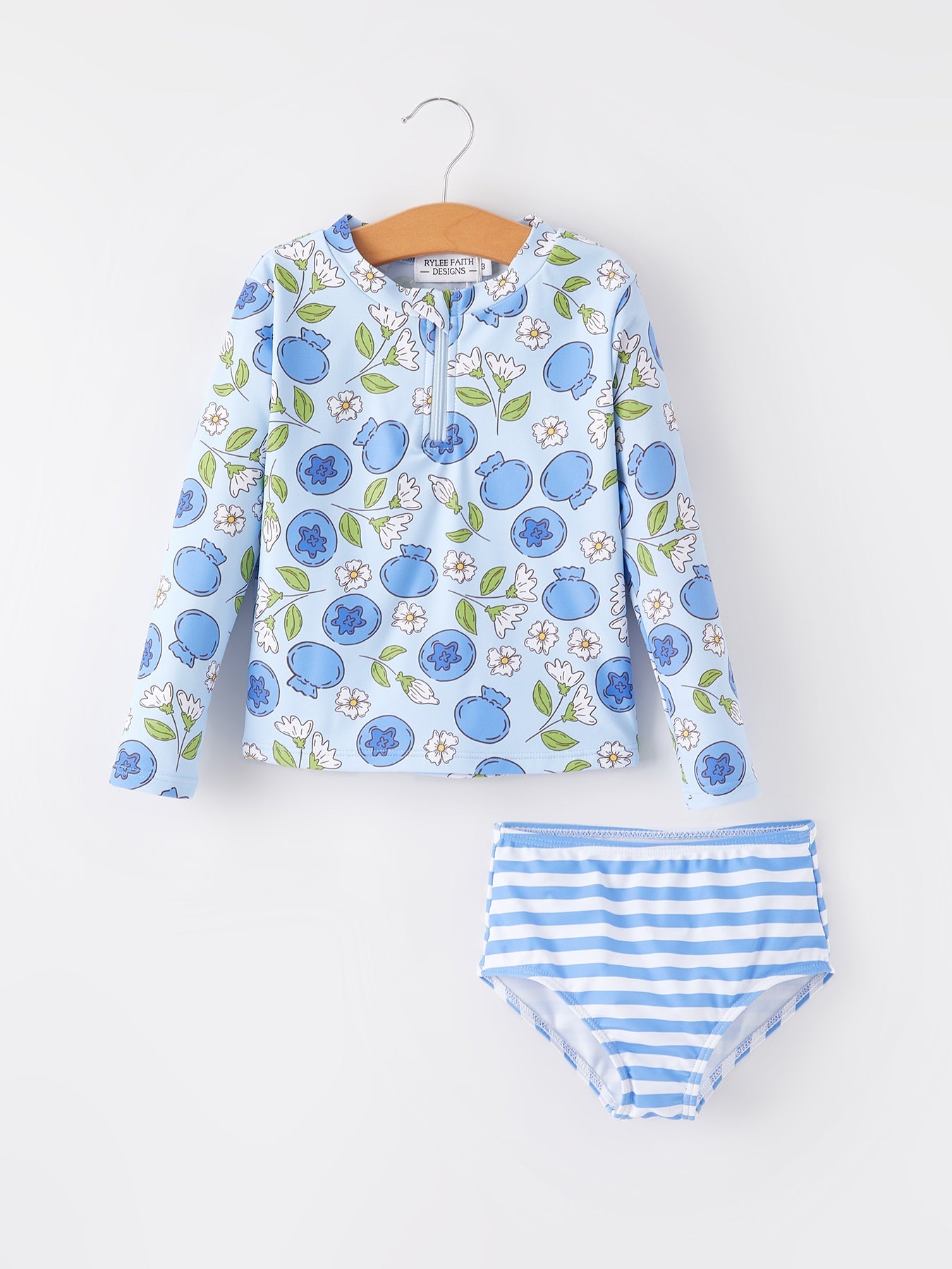 Children's floral long-sleeve shirt and striped underwear set on a white background