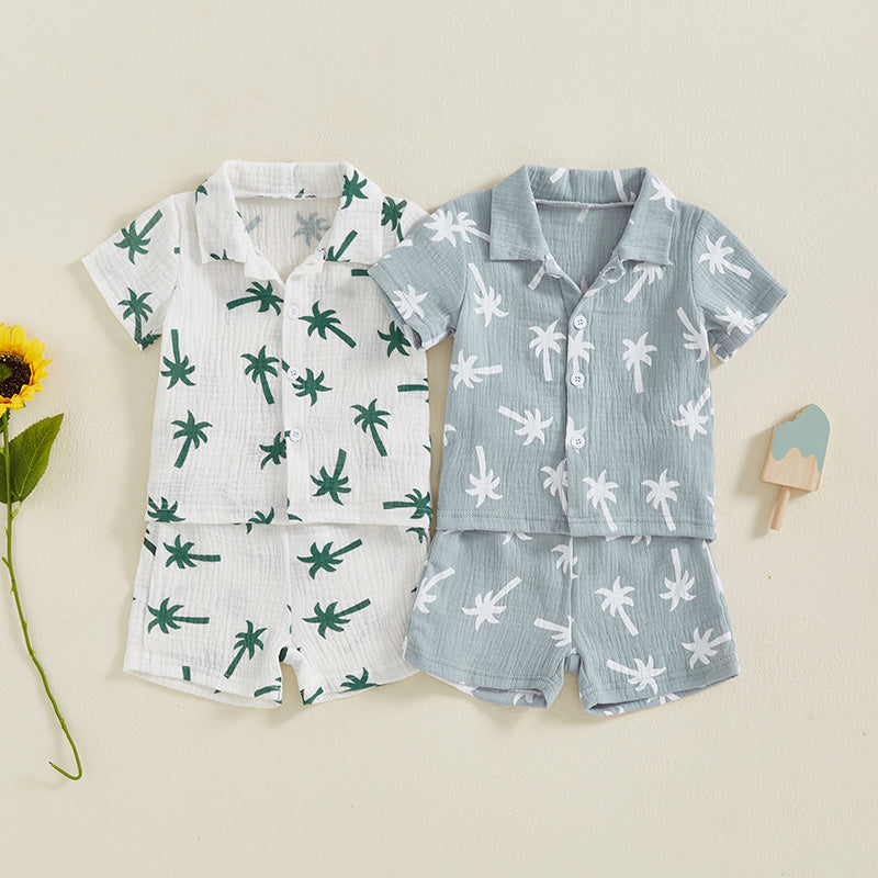 Children's pajama set with palm tree patterns on a beige background