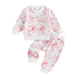 Children's pajama set with pink floral pattern on a white background