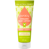 Puracy organic baby lotion tube on a green background