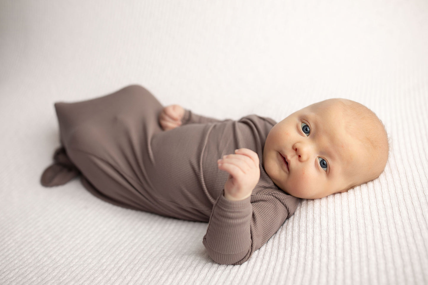 Ultra-soft, stretchy gender neutral baby gowns designed for comfort, featuring tie bottom and pull-down shoulder tabs for convenience.
