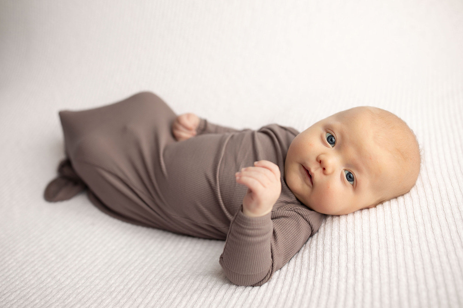Ultra-soft, stretchy gender neutral baby gowns designed for comfort, featuring tie bottom and pull-down shoulder tabs for convenience.