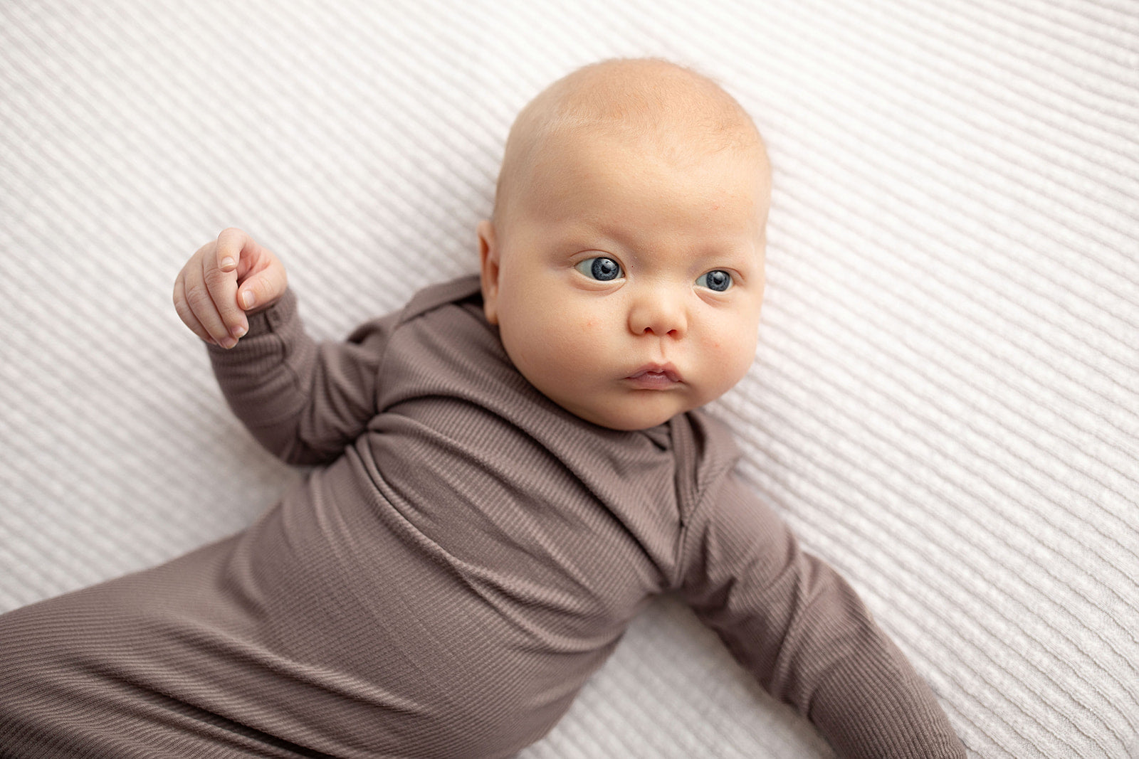 Ultra-soft, stretchy gender neutral baby gowns designed for comfort, featuring tie bottom and pull-down shoulder tabs for convenience.