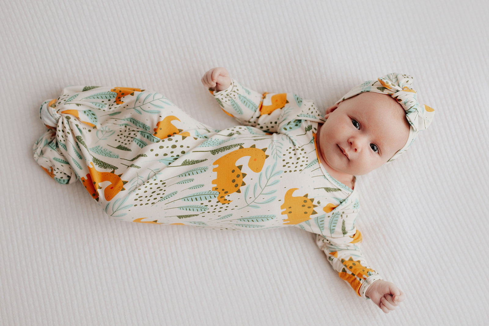 Ultra-soft Dinosaur baby gowns with stretchy fabric and tie bottom for easy night-time diaper changes.