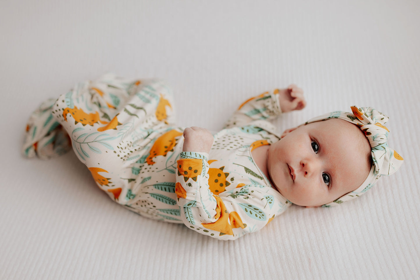 Ultra-soft Dinosaur baby gowns with stretchy fabric and tie bottom for easy night-time diaper changes.