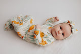 Ultra-soft Dinosaur baby gowns with stretchy fabric and tie bottom for easy night-time diaper changes.