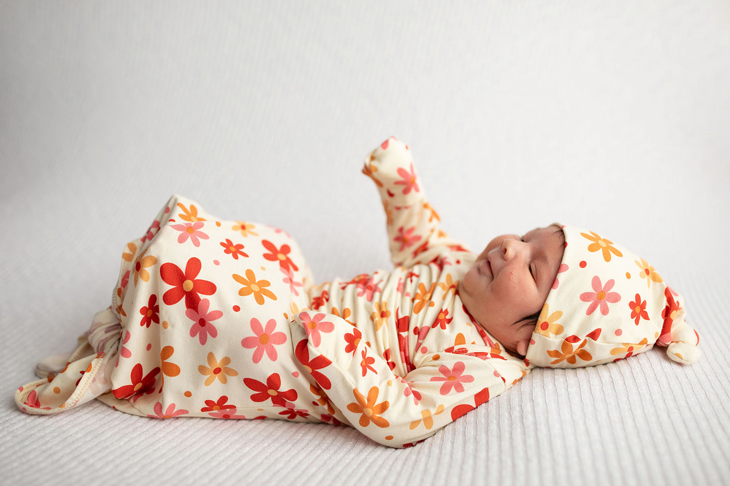 Three Little Tots Flower 70s knotted newborn baby gown is ultra soft and the perfect gift for a newborn baby. 