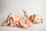 Three Little Tots Flower 70s knotted newborn baby gown is ultra soft and the perfect gift for a newborn baby. 