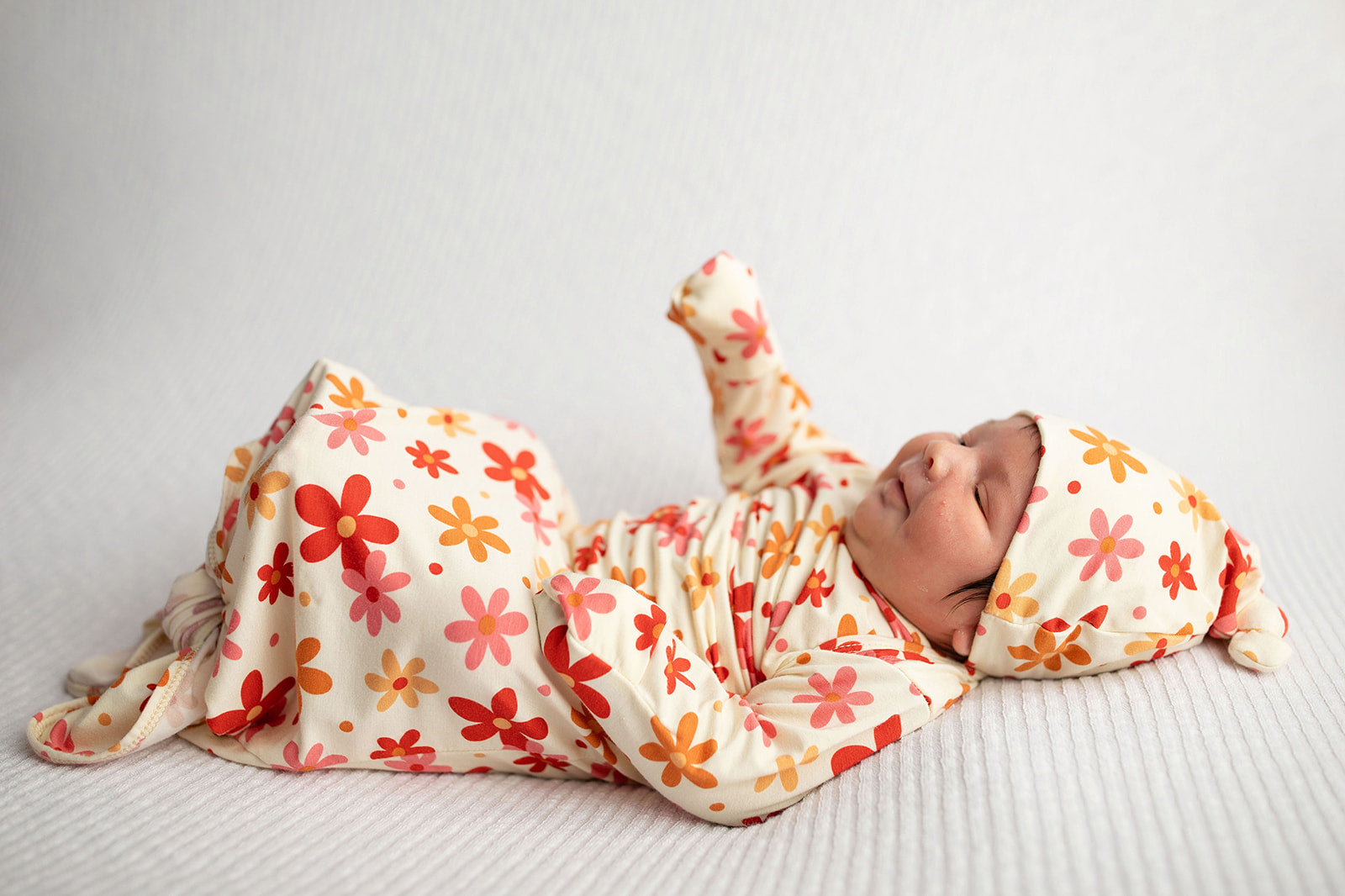 Three Little Tots Flower 70s knotted newborn baby gown is ultra soft and the perfect gift for a newborn baby. 