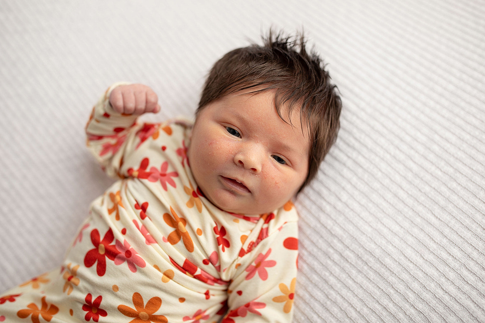 Three Little Tots Flower 70s knotted newborn baby gown is ultra soft and the perfect gift for a newborn baby. 