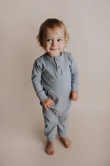 Experience ultimate comfort with our soft ribbed cotton onesie, perfect for both lounging and adventures.