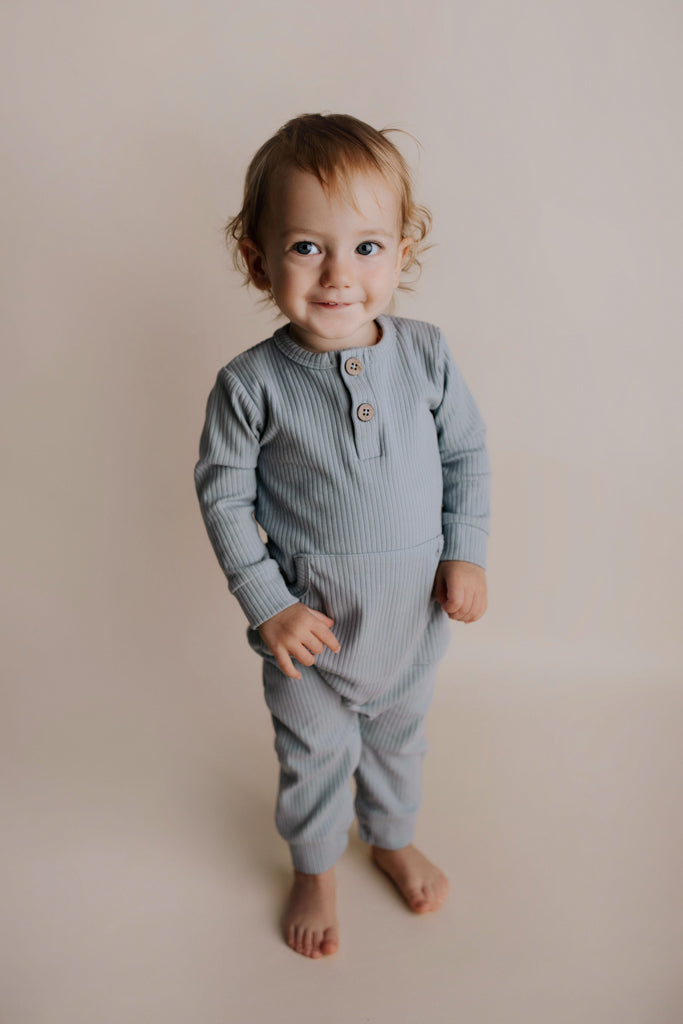 Experience ultimate comfort with our soft ribbed cotton onesie, perfect for both lounging and adventures.