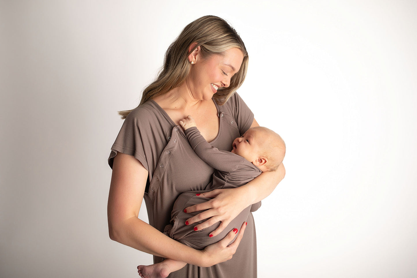 Ultra-soft, stretchy gender neutral baby gowns designed for comfort, featuring tie bottom and pull-down shoulder tabs for convenience.