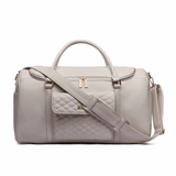 Three Little Tots Weekender Travel Bag Pearl White, attached to a car seat or stroller