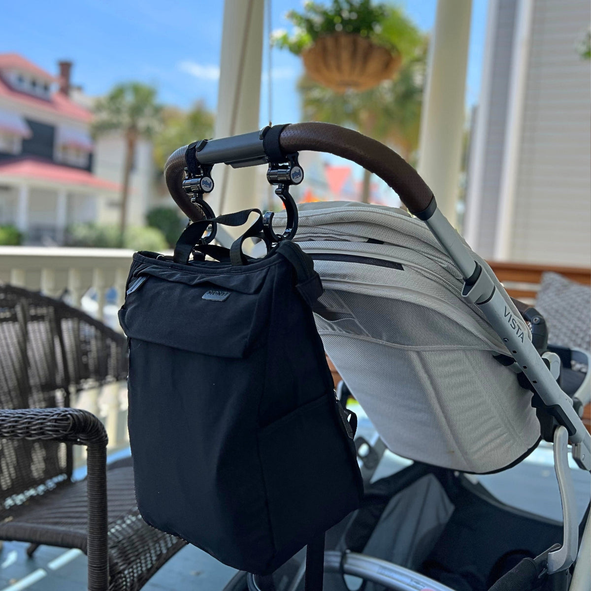 Three Little Tots The Adventure Diaper Bag, attached to a car seat or stroller