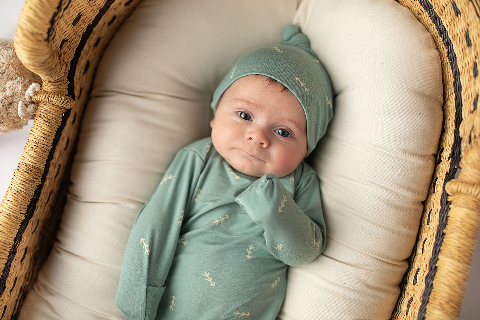 Three Little Tots Arrow Newborn Knotted Baby Gown. Ultra Soft baby gown. Newborn photoshoot idea with the Snuggle Me organic in a Plum + Sparrow Moses Baby Basket