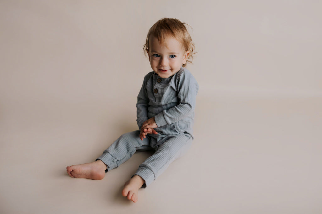 Experience ultimate comfort with our soft ribbed cotton onesie, perfect for both lounging and adventures.