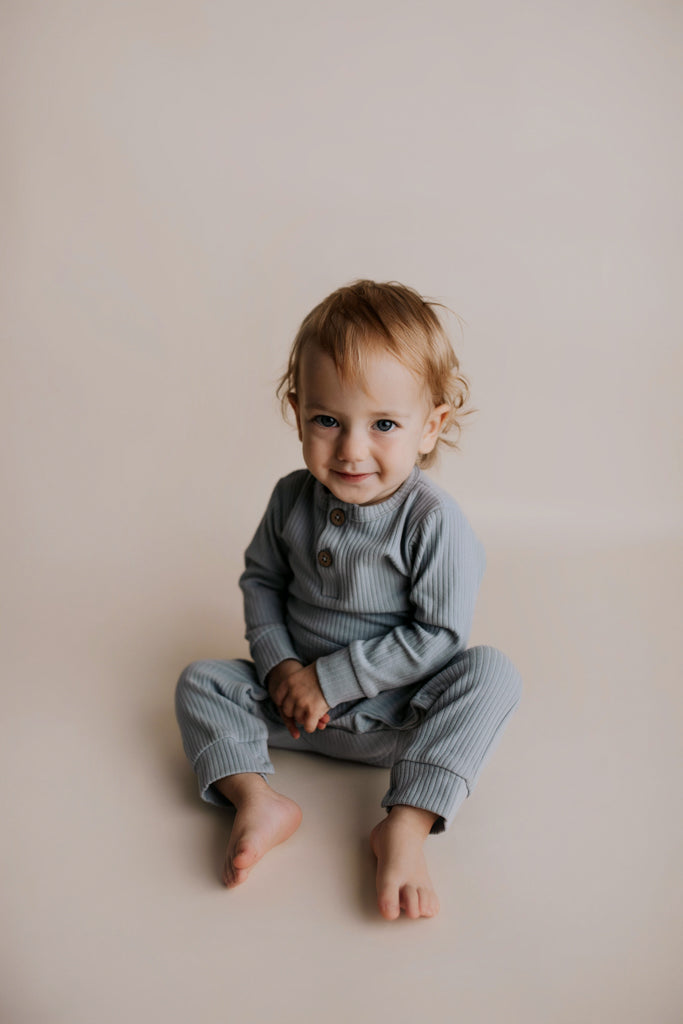 Experience ultimate comfort with our soft ribbed cotton onesie, perfect for both lounging and adventures.