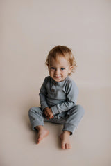Experience ultimate comfort with our soft ribbed cotton onesie, perfect for both lounging and adventures.