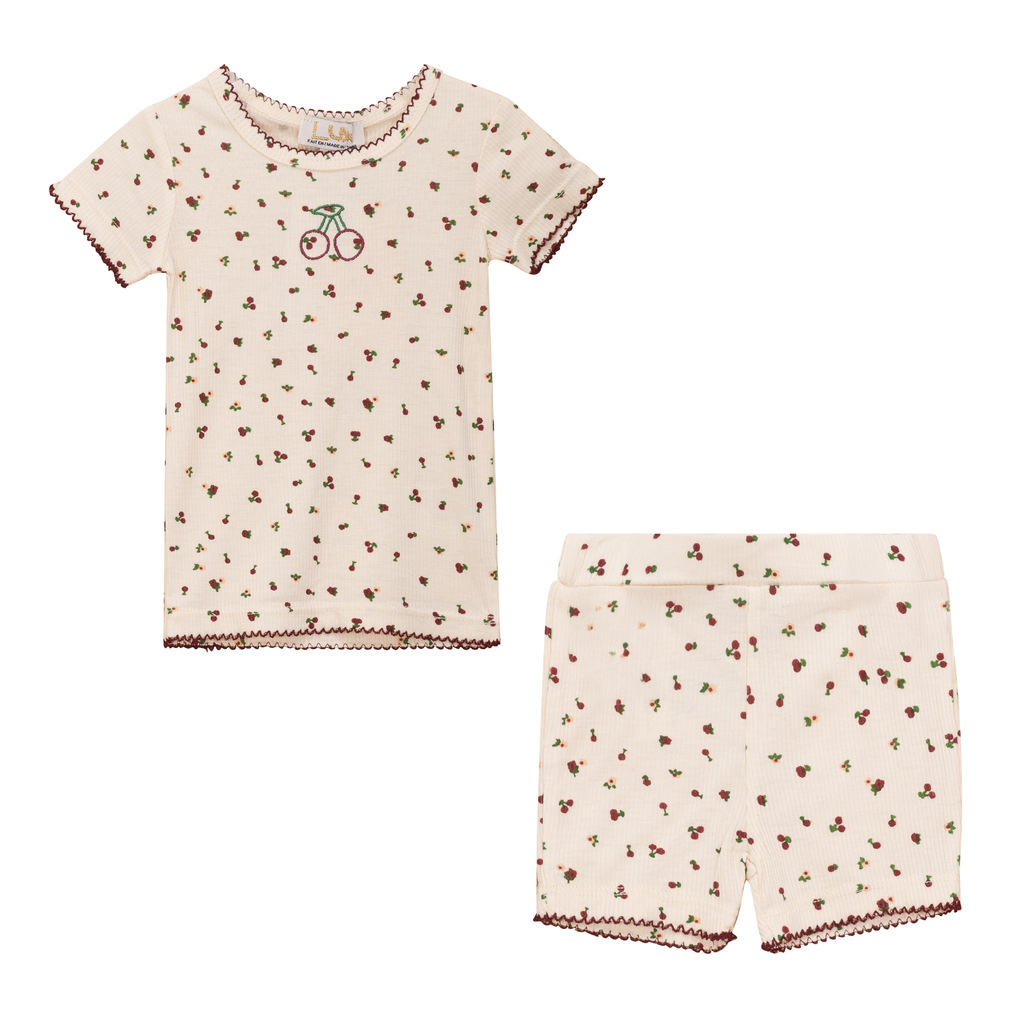 Children's pajama set with short-sleeve top and shorts on a white background