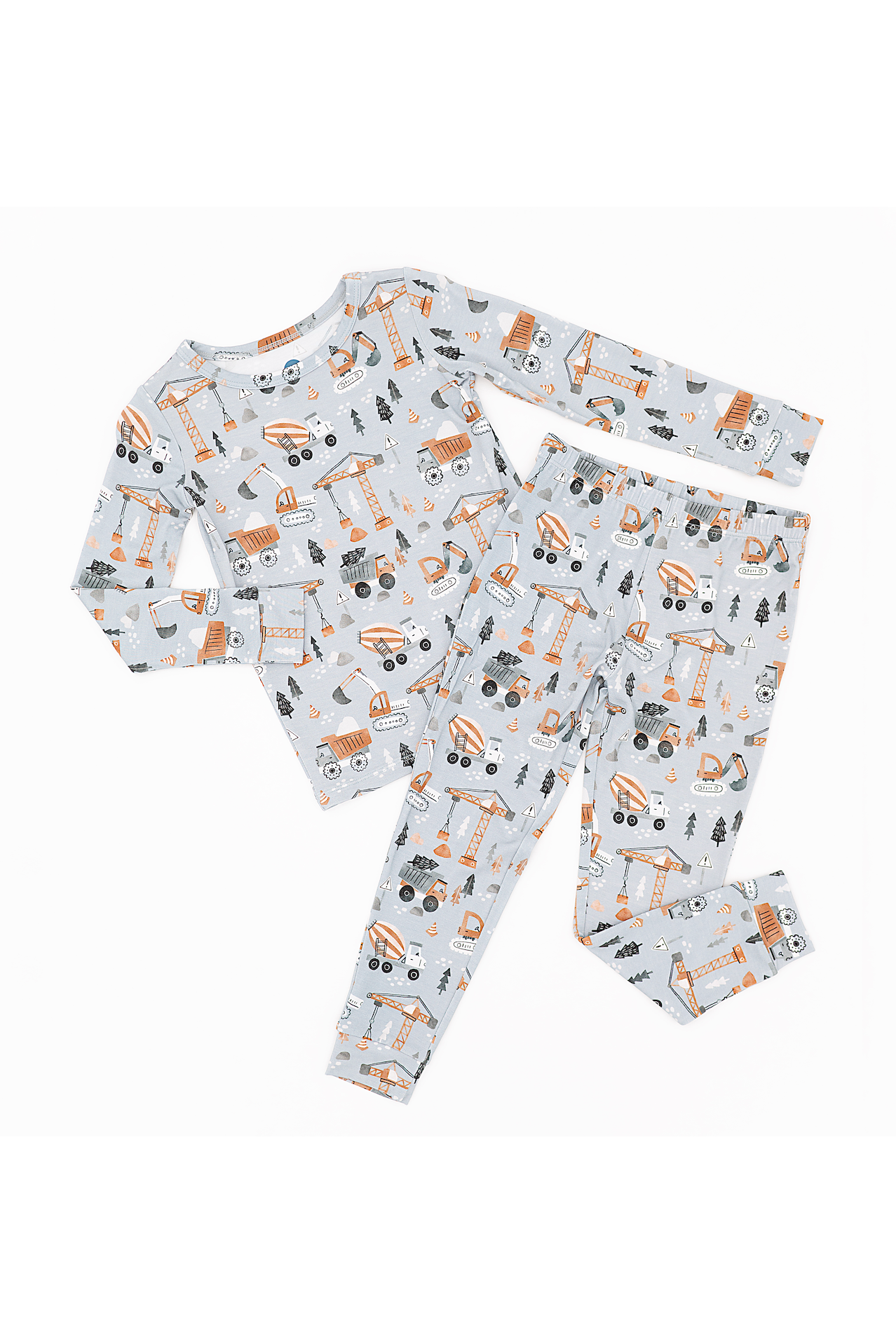 Children's pajama set with construction vehicle pattern on a white background