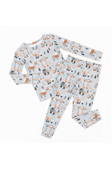 Children's pajama set with construction vehicle pattern on a white background