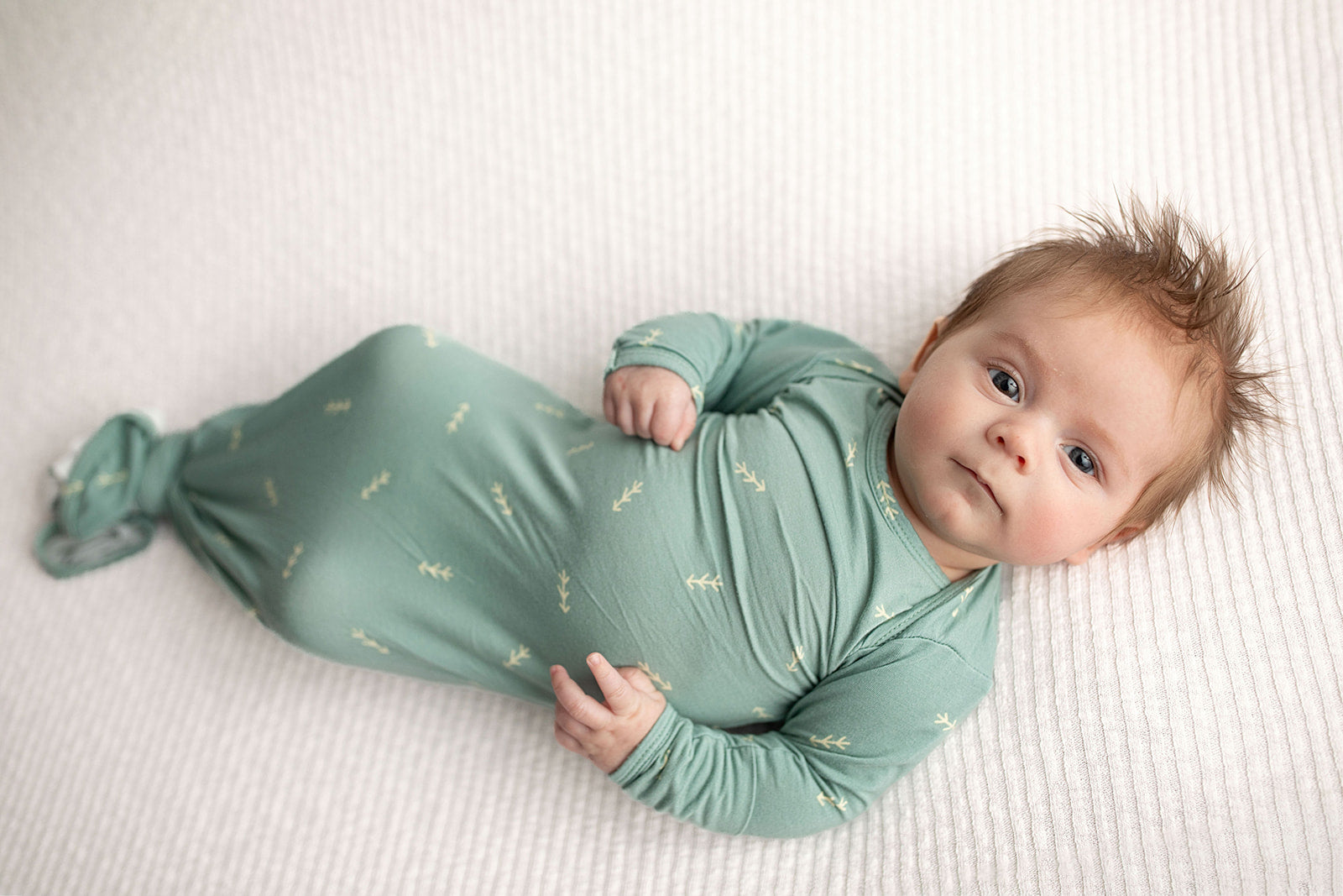 Three Little Tots Arrow Newborn Knotted Baby Gown. Ultra Soft baby gown. Newborn photoshoot idea with a newborn baby in a Three Little Tots Knotted Baby gown