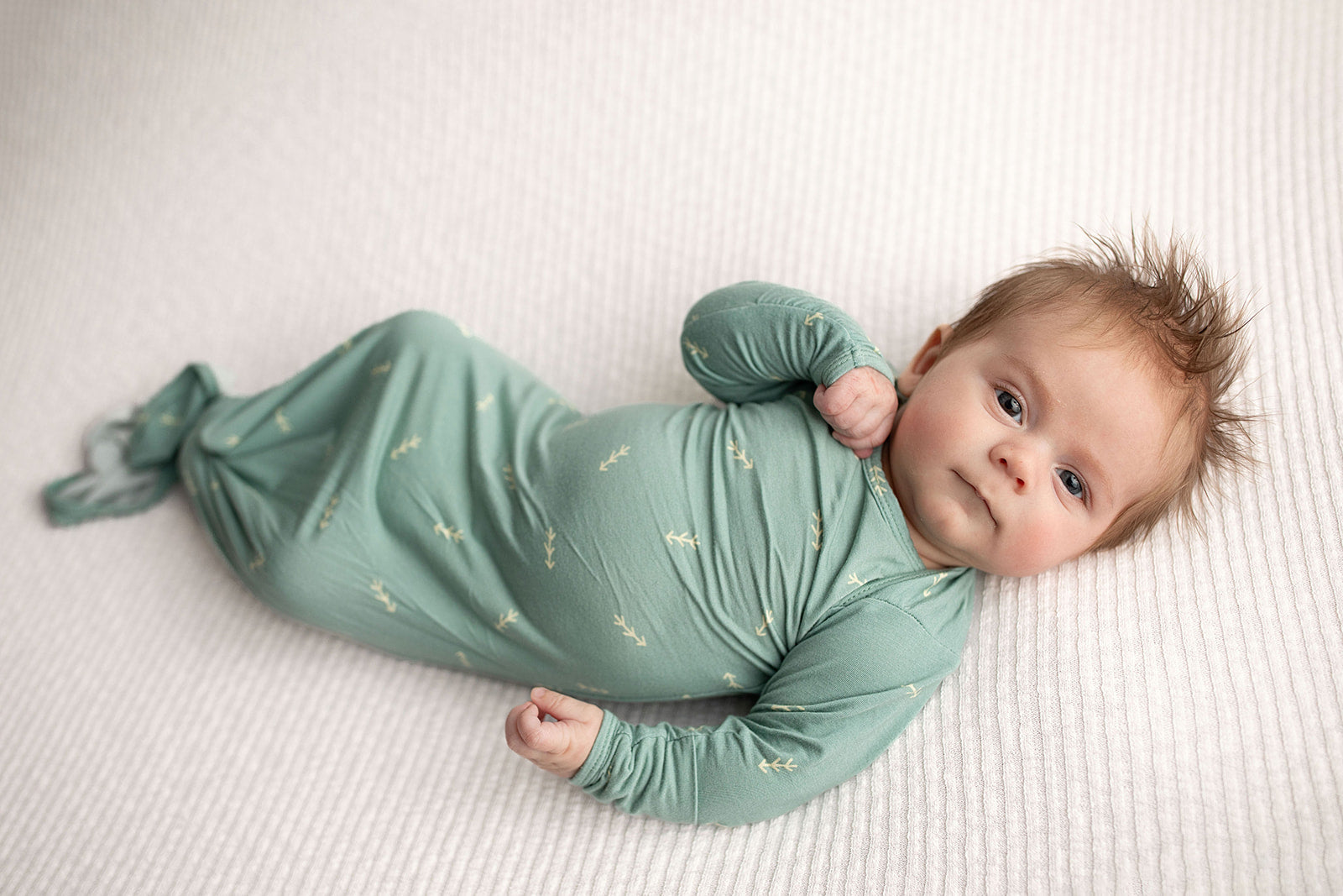 Three Little Tots Arrow Newborn Knotted Baby Gown. Ultra Soft baby gown. Newborn baby boy with lots of hair.