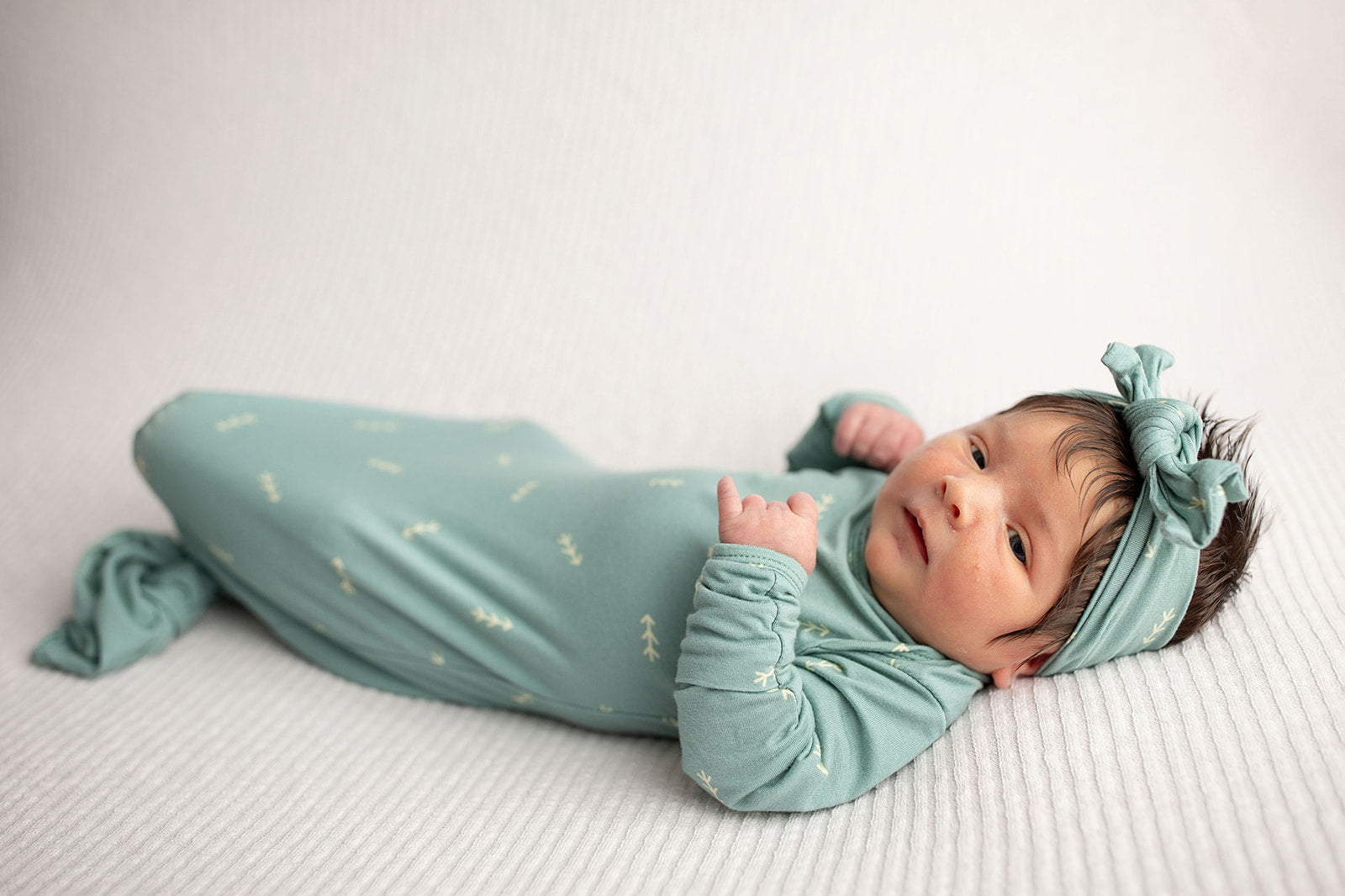 Three Little Tots Arrow Newborn Knotted Baby Gown with bow. Newborn baby girl with knotted bow and lots of hair