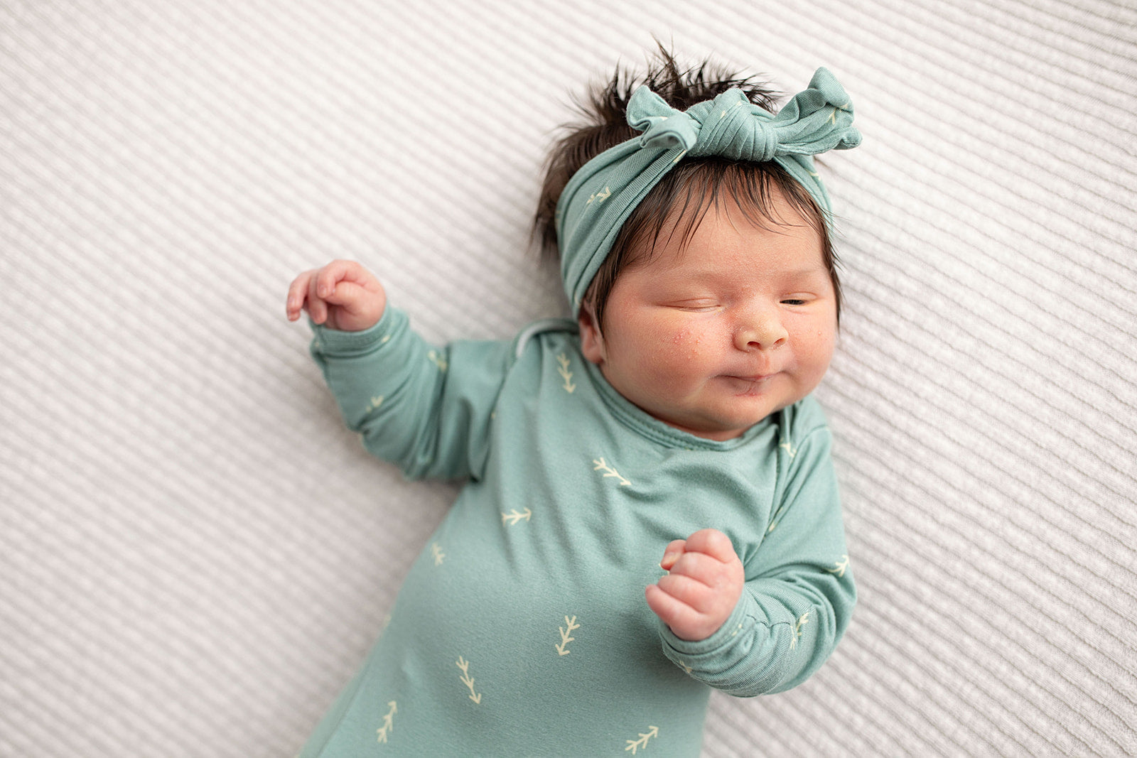 Three Little Tots Arrow Newborn Knotted Baby Gown with bow. Newborn baby photoshoot with lots of hair