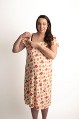 Three Little Tots Groovy Floral Hospital Labor and Delivery Gown. Hospital gown that features snaps down the shoulders. These snaps allow for easy access to pull up and down IVs and easy access for instant skin on skin and breastfeeding.