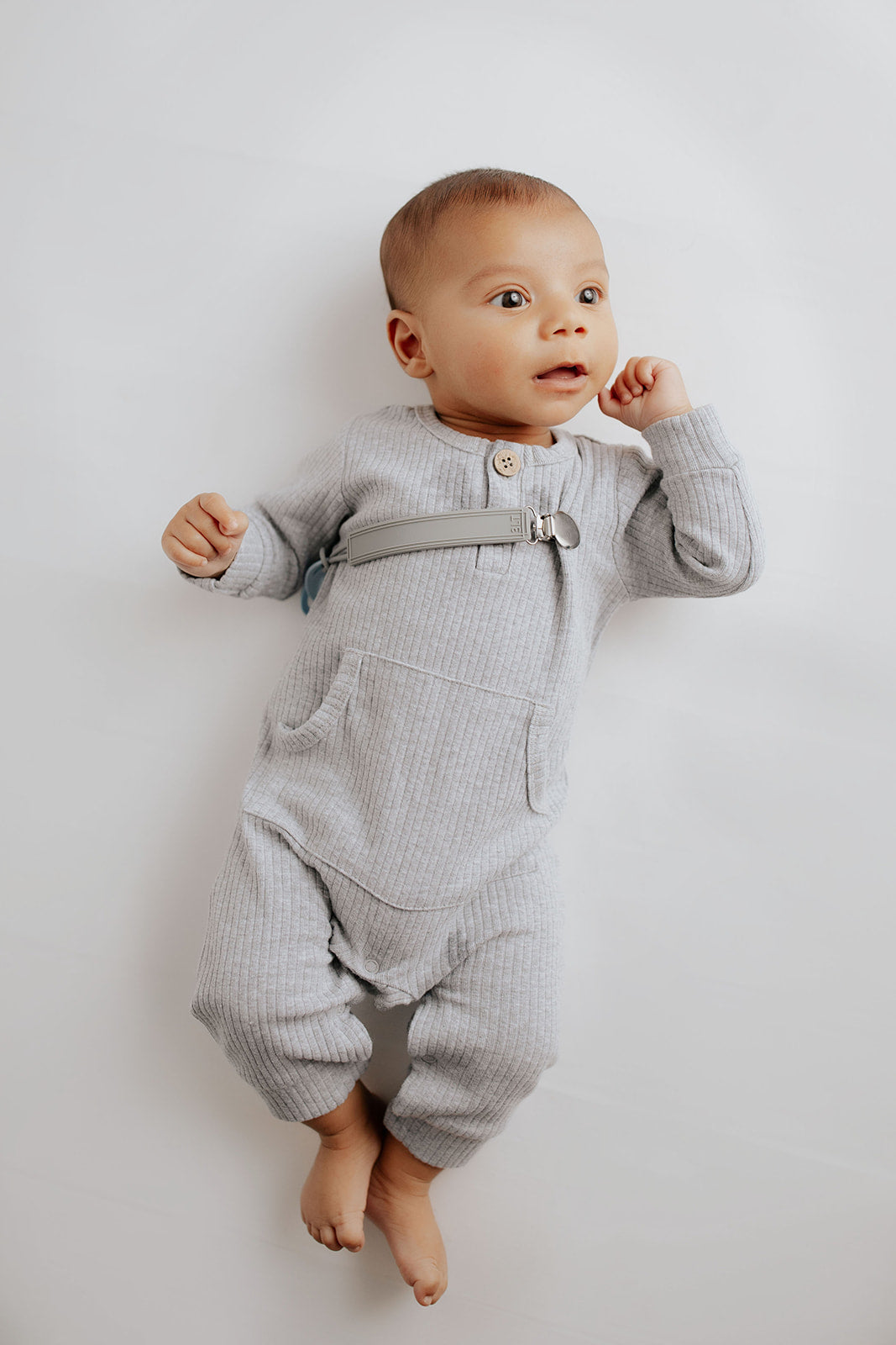 Stylish and functional, our ribbed organic cotton long-sleeve onesie features leg snaps and buttons for easy changes.