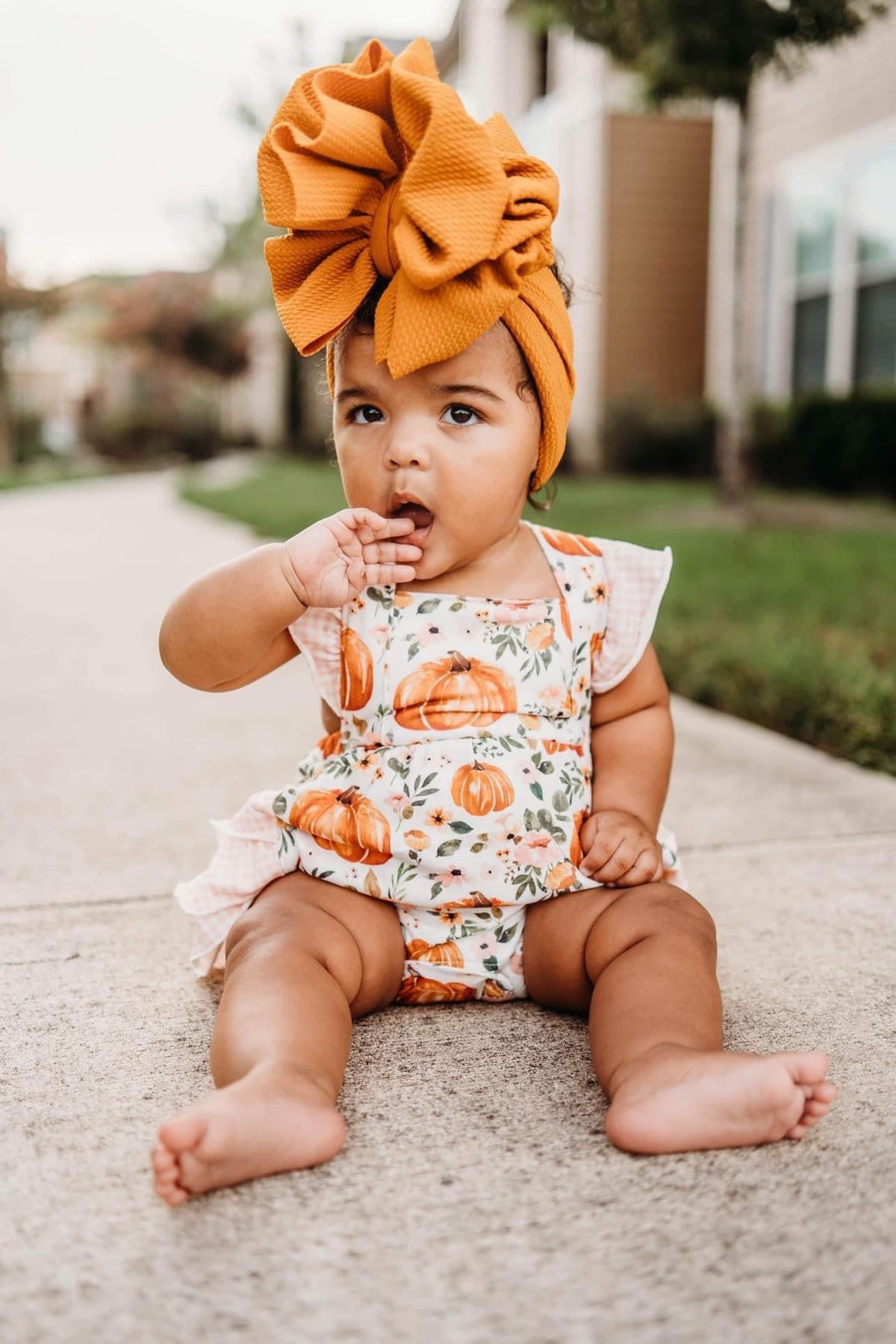 Floral pumpkin ruffle romper