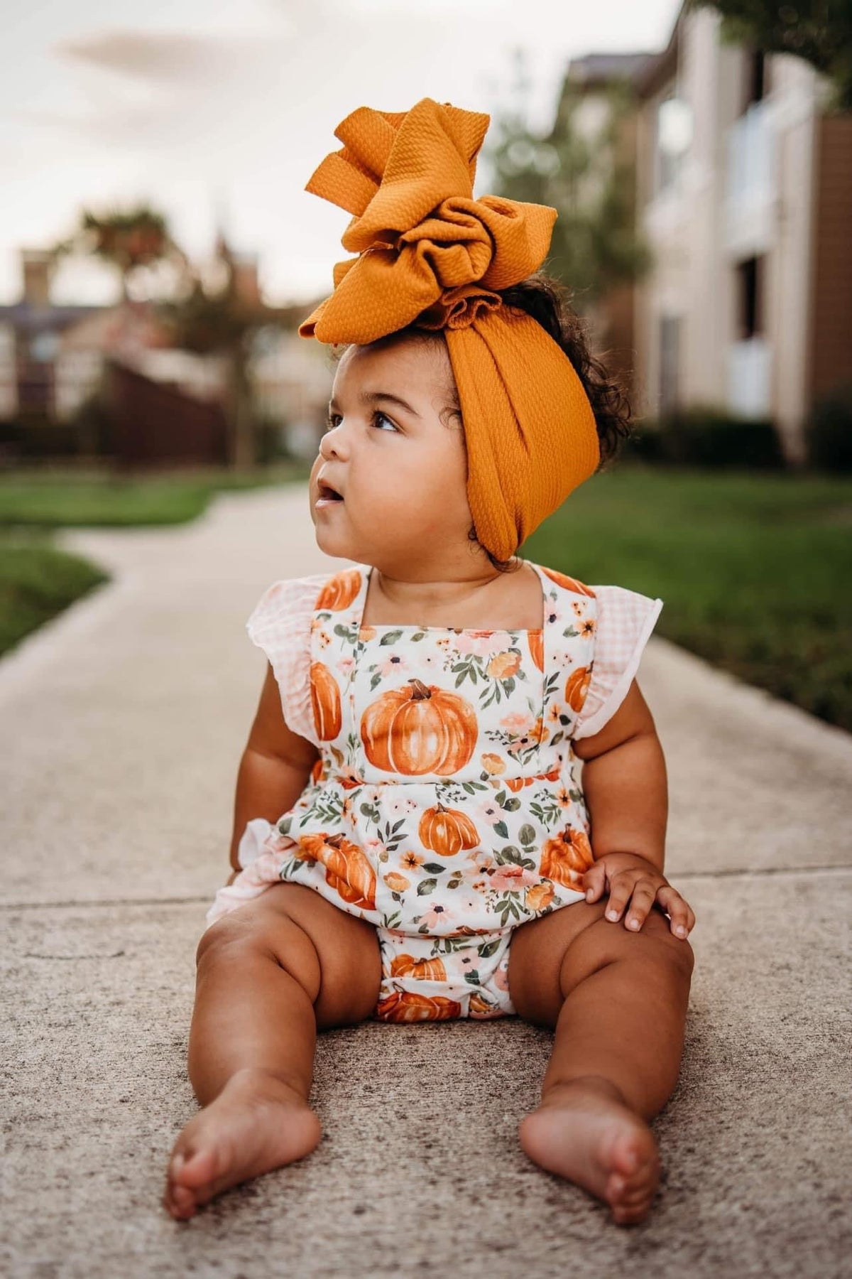 Floral pumpkin ruffle romper