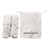 Three Little Tots Organic Muslin Crib Sheets Set of 2, attached to a car seat or stroller