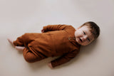 Ribbed long-sleeve onesie with two buttons and leg snaps, crafted from the softest organic cotton blend.
