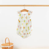 Baby romper with ice cream pattern hanging on a wooden hanger against a white background.