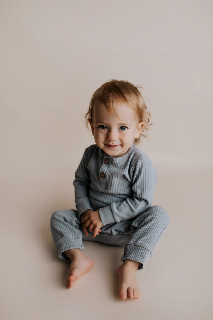 Experience ultimate comfort with our soft ribbed cotton onesie, perfect for both lounging and adventures.
