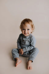 Experience ultimate comfort with our soft ribbed cotton onesie, perfect for both lounging and adventures.
