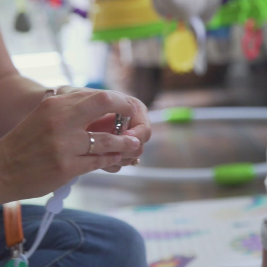 Three Little Tots all silicone one piece pacifier clip. This paci clip is flexible and easy to clean.